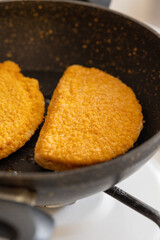 cordon bleu chicken nuggets with salami in close-up
