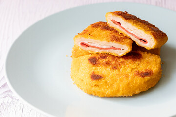 cordon bleu chicken nuggets with salami in close-up