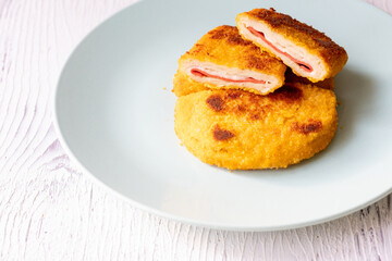 cordon bleu chicken nuggets with salami in close-up