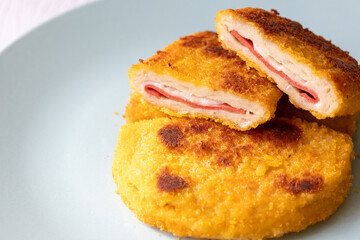 cordon bleu chicken nuggets with salami in close-up