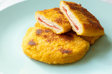 cordon bleu chicken nuggets with salami in close-up