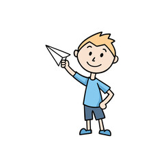 Joyful young boy happily throws a paper airplane into the sky