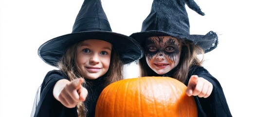 The cheerful witches with a pumpkin celebrating Halloween together.