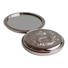 Ornate Silver Compact Mirror with Intricate Design and Reflection