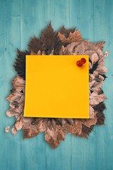 Fototapeta premium Autumn leaves with yellow note