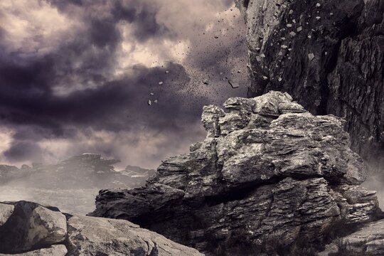 Fototapeta Rocks against cloudy sky during sunset