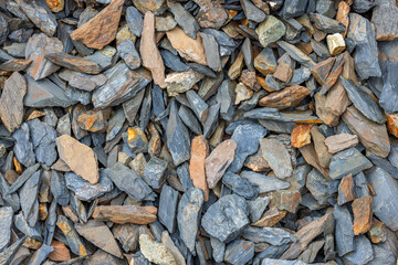Various colorful rocks on the ground in natural environment, closeup high angle view