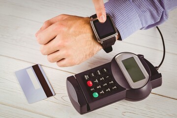 Man using smart watch to express pay