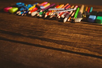 High angle view of color pencils on wooden table