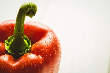 Fresh red pepper on wooden table
