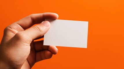Hand holding a white business card