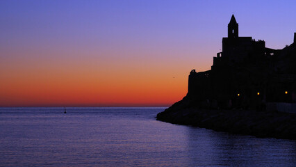 sunset in Portovenere with the silhouette of the church of San Pietro in Portovenere