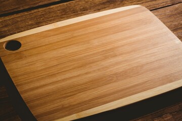 Chopping board on wooden flooring