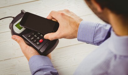 Man using smartphone to express pay