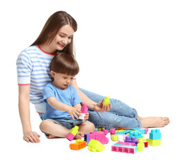 Obraz premium Mother and son playing with building bricks on white background
