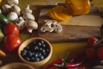 Berries and mushrooms on table