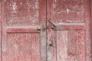 An old red wooden door