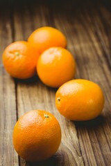 Close-up of oranges on wooden table