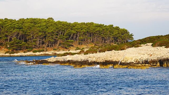 Uninhabited islands of the Lastovo National Park surrounded by calm sea in Croatia. Nature reserve, remote landscape and Mediterranean summer escape
