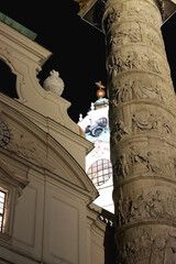 St. Charles's Church, baroque landmark in Vienna, Austria, illuminated at night.