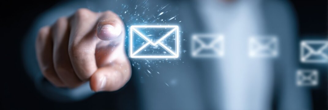 Modern digital concept of sending email messages with glowing envelope icons and hand interacting with futuristic communication technology