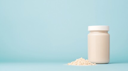 Creamy protein shake in a bottle with a pile of powder on a light blue background