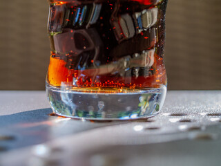 Glass of soda with a swirl pattern on the side