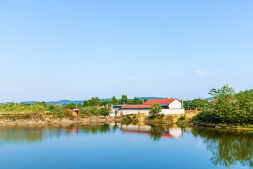 The scene of fish ponds under the blue sky in Huangxu Town, Deyang City, Sichuan Province, China