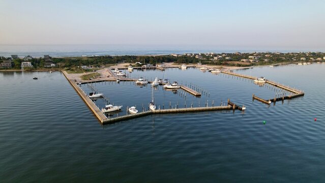 Aerial view of a serene marina with boats docked.