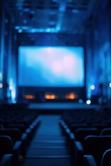 Empty Movie Theater Auditorium with Large Projection Screen and Blue Lighting