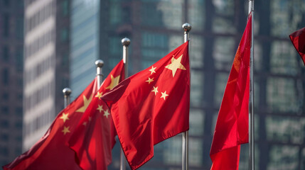 Chinese flags waving in front of modern skyscrapers showcasing China's economic development and urban modernization in major business district
