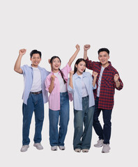 Obraz premium Celebrating success a diverse group of young adults enthusiastically pose with raised fists smiling