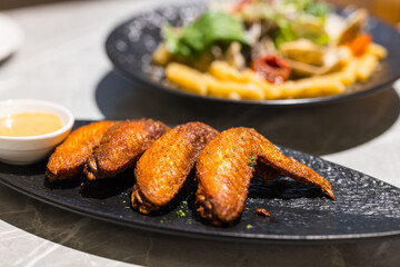 Golden chicken wings freshly deep fried today