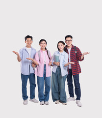 Obraz premium Diverse student group presenting with open palms youthful and inclusive standing in a row together