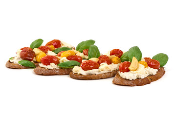 Bruschetta with Tomatoes, cream Cheese, basil, isolated on white background