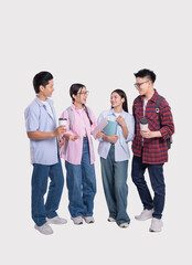 Obraz premium Group of smiling students with books and coffee enjoying a conversation on neutral backdrop