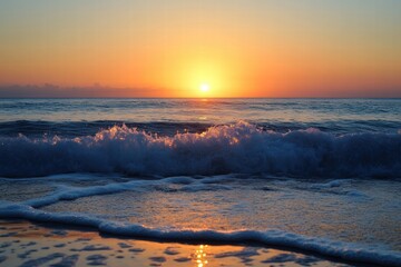 Early morning sunrise with glowing waves and calm sea