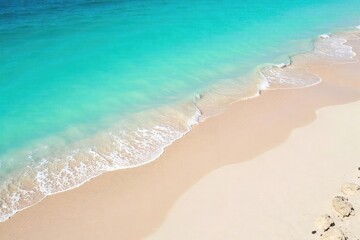 Obraz premium Fine, light-colored sand gently slopes down to meet the tranquil, turquoise ocean waves on a sunny day Perfect for travel, vacation, or coastal themed projects , seascape, beach, tropical