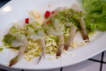 Raw Shrimp in Fish Sauce served on plate. Thai food