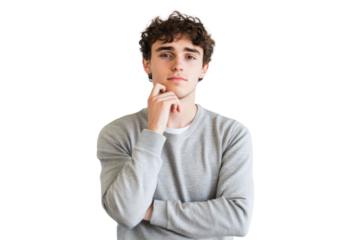 A young man stands thoughtfully with his hand on his chin against a white background PNG