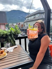 young woman in the restaurant with drink summer 