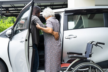 Asian senior woman patient sitting on walker prepare get to her car, healthy strong medical concept.
