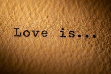 Love is, the inscription on a typewriter.