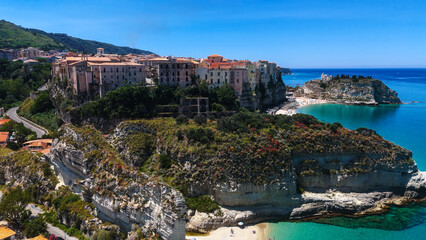 Aerial view of Tropea, Italy, a charming town perched on cliffs, overlooking the turquoise waters...