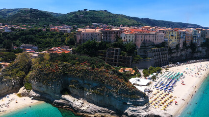 Aerial view of Tropea, a charming town perched on a cliff overlooking the turquoise waters of the...