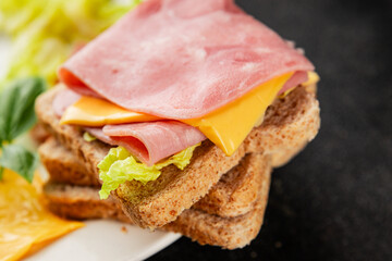 Sandwich ham, cheese, bread toast meat spam fresh delicious gourmet food background on the table rustic food top view copy space