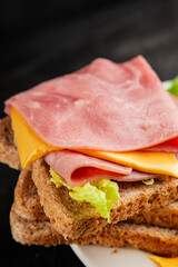 Sandwich ham, cheese, bread toast meat spam fresh delicious gourmet food background on the table rustic food top view copy space