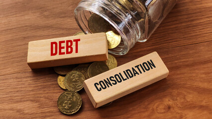 Debt Consolidation Concept with Coins Jar and Wooden Blocks