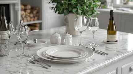 Fototapeta premium Elegant white tableware arranged on a marble countertop in a light-filled kitchen
