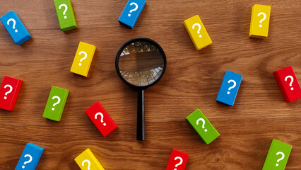 Finding Answers: Magnifying Glass Amidst Question Blocks